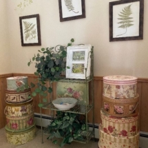 Neat painted metal plant stand - hatboxes galore. Great for storage! 