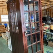 Handcrafted telephone booth , wine rack interior