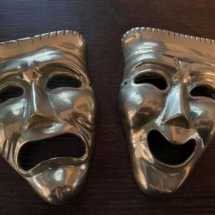 Pair of vintage brass harlequin faces