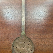 Antique copper strainer spoon