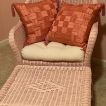 Pink wicker chair and ottoman