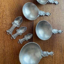 Hand crafted pewter measuring spoons and cups
