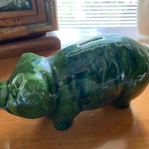 Green ceramic piggy bank