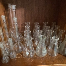 Many vintage Pyrex beakers