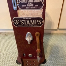 Antique 3-cent stamp machine with key