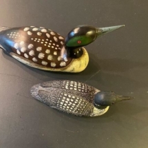 Signed carved loons