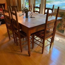 Antique farm table and ladder back chairs
