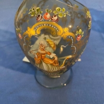 Enameled flowers and figures attributed to Moses. Unusual offset opening on bulbous tear shape glass