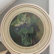 Vintage floral print in lovely round frame.