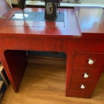 Antique cast iron Kenmore sewing machine and cabinet 