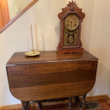 Antique gate leg table and gingerbread clock