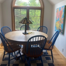 Antique round oak table with newer oak chairs