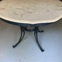 Marble top table with wrought iron base