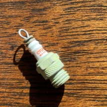 Miniature Champion spark plug- advertising piece