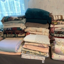Stacks of very clean, great condition blankets, throws, quilts and pillows